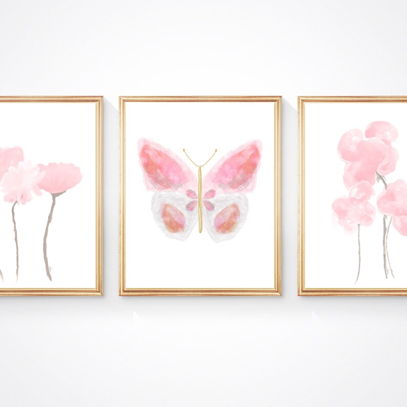 May include: Three framed watercolor prints with a pink butterfly in the center and pink flowers on either side.