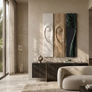 May include: Three vertical rectangular wall panels featuring relief carvings. The left panel is white marble with a face, the center is tan stone with a face, and the right is a dark green stone panel depicting a stylized tree with leaves.