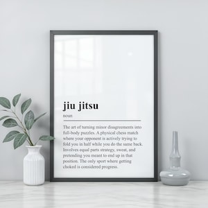 May include: A framed wall art print featuring a dictionary-style definition of jiu jitsu. The text reads: jiu jitsu, noun, the art of turning minor disagreements into full-body puzzles. A physical chess match where getting choked is progress.