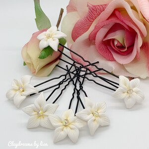 Bridal Hair Pins. White flower wedding hair accessory.