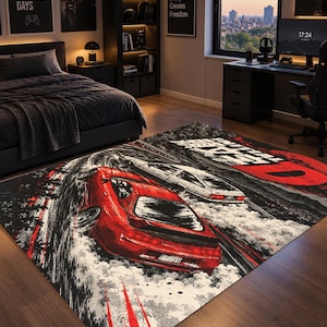 May include: A rectangular area rug featuring a graphic illustration of a red sports car drifting alongside a white car on a dark road. The design includes the text Initial D in bold red and white lettering, with stylized tire smoke and red streaks.