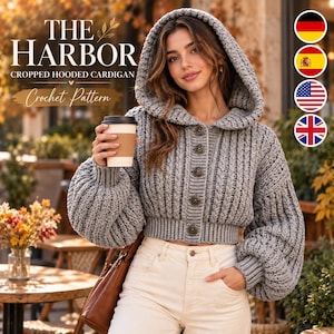 May include: A grey cropped hooded cardigan with a ribbed texture, long balloon sleeves, and five dark circular buttons. The text on the image reads THE HARBOR CROPPED HOODED CARDIGAN Crochet Pattern. The garment is worn with light-colored pants.