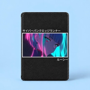May include: A black rectangular case featuring a central graphic of an anime character with short hair illuminated by pink and blue neon lighting. The text "サイバーパンクエッジランナー" appears above the image, and "ルーシー" is printed below the graphic.