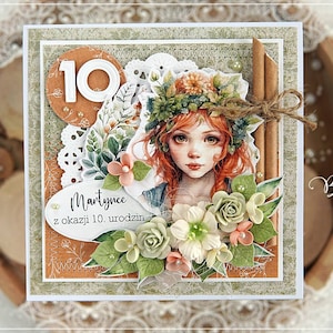 May include: A handmade card with a floral design featuring a girl with red hair wearing a flower crown. The card has a white background with a brown border and the text "Martynce z okazji 10. urodzin" in black.