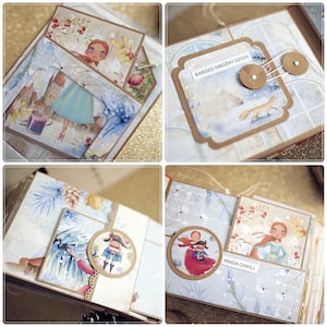 May include: A scrapbook with a winter theme. The pages are decorated with snowflakes, pine trees, and other wintery elements. The pages also feature illustrations of a girl in a blue dress, a nutcracker, and a fox. The text on the pages reads "Bardzo mroźny dzień" and "Magia chwili".