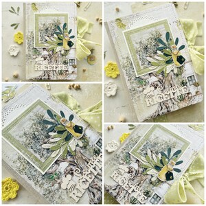 May include: A white and green recipe book with a stitched border and a picture of an olive tree with a bottle of olive oil. The book has the words "Le mie Ricette" on the front.