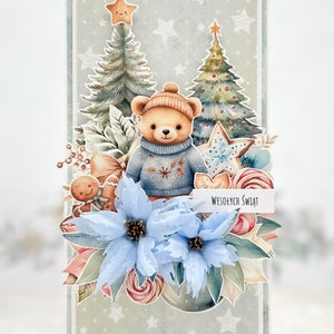 May include: A Christmas card featuring a teddy bear wearing a blue sweater and a Santa hat, standing in front of two Christmas trees. The card has a blue poinsettia, gingerbread man, candy canes, and a banner that reads "Wesołych Świąt" which means "Merry Christmas" in Polish.