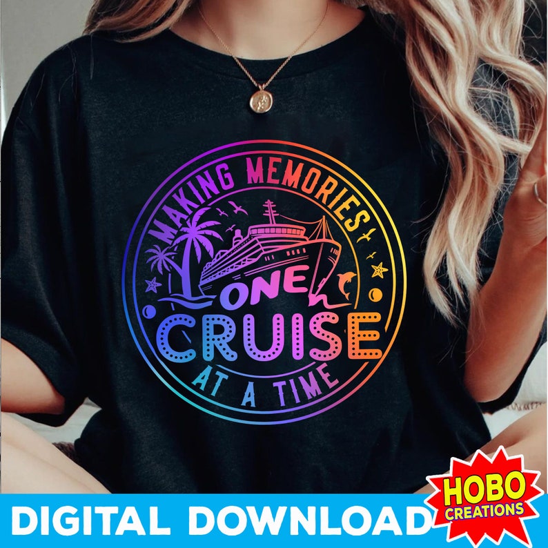 May include: A black t-shirt with a rainbow colored circle graphic. The graphic features a cruise ship, palm trees, and the text "Making Memories One Cruise At A Time".