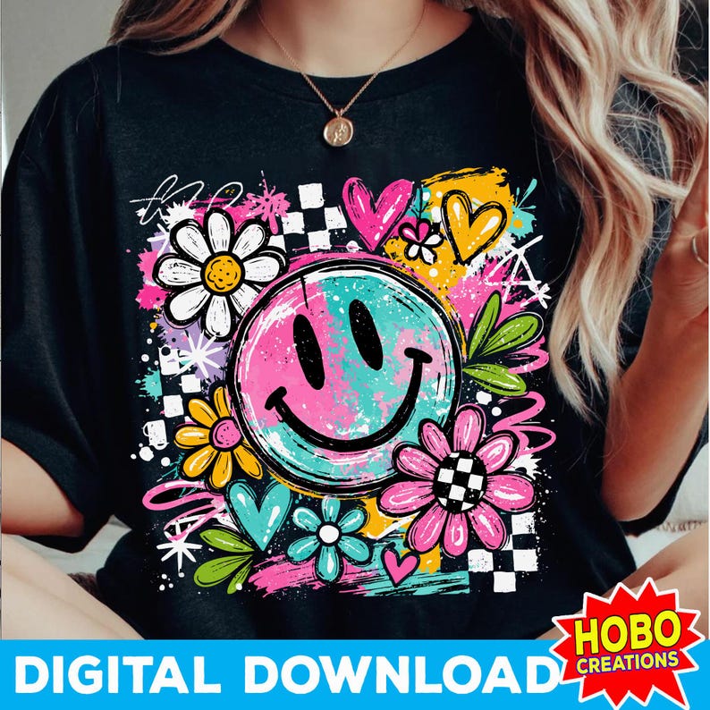 May include: Black t-shirt featuring a colorful graphic design. The design includes a smiley face, flowers, hearts, and a checkered pattern. The words "DIGITAL DOWNLOAD" are at the bottom. The design has a retro, groovy vibe.