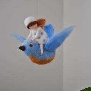 Bird mobile /wool decoration /WaldorfiInspired wall hanging: The girl and the blue bird flying. Made to order.