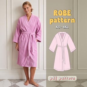 May include: A light purple robe with long sleeves, a shawl collar, and a matching tie belt. The image includes the text ROBE pattern, XS - 4XL, and pdf pattern, alongside a technical line drawing of the robe design in light pink.
