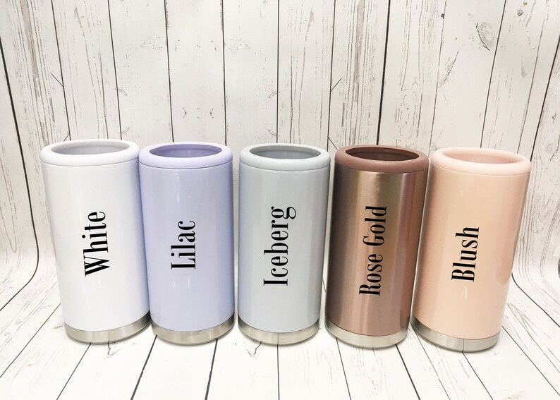 May include: Five insulated can coolers in different colors: white, lilac, light gray, rose gold, and blush. The coolers have the color names printed on them.