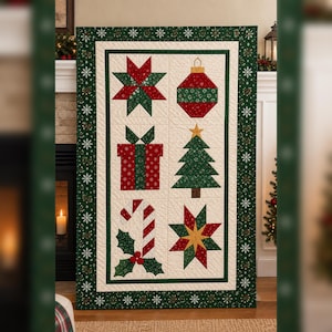 May include: A rectangular quilt featuring a dark green border with white snowflake patterns. The centre panel displays six holiday-themed blocks: a red and green star, a red and green ornament, a gift box, a pine tree, a candy cane with holly, and a star.