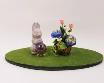 Miniature dollhouse scale ceramic rabbit with gazing ball.