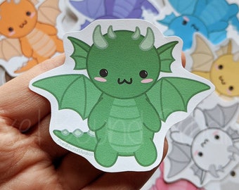 May include: A set of nine colorful cartoon dragon stickers with cute faces. The stickers are on a gray background with white clouds.