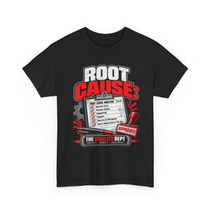 May include: A black short-sleeve t-shirt featuring a graphic with the text ROOT CAUSE: and a clipboard labeled ROOT CAUSE ANALYSIS with checked boxes. A red rubber stamp reads APPROVED, and the text THE QUALITY DEPT INSPECT VERIFY DOCUMENT appears below.