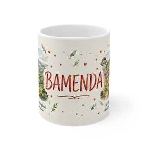 May include: A white ceramic mug featuring the word Bamenda in large red script. The design includes watercolor-style illustrations of green landscapes, trees, and small red hearts scattered across the surface, along with small text details.