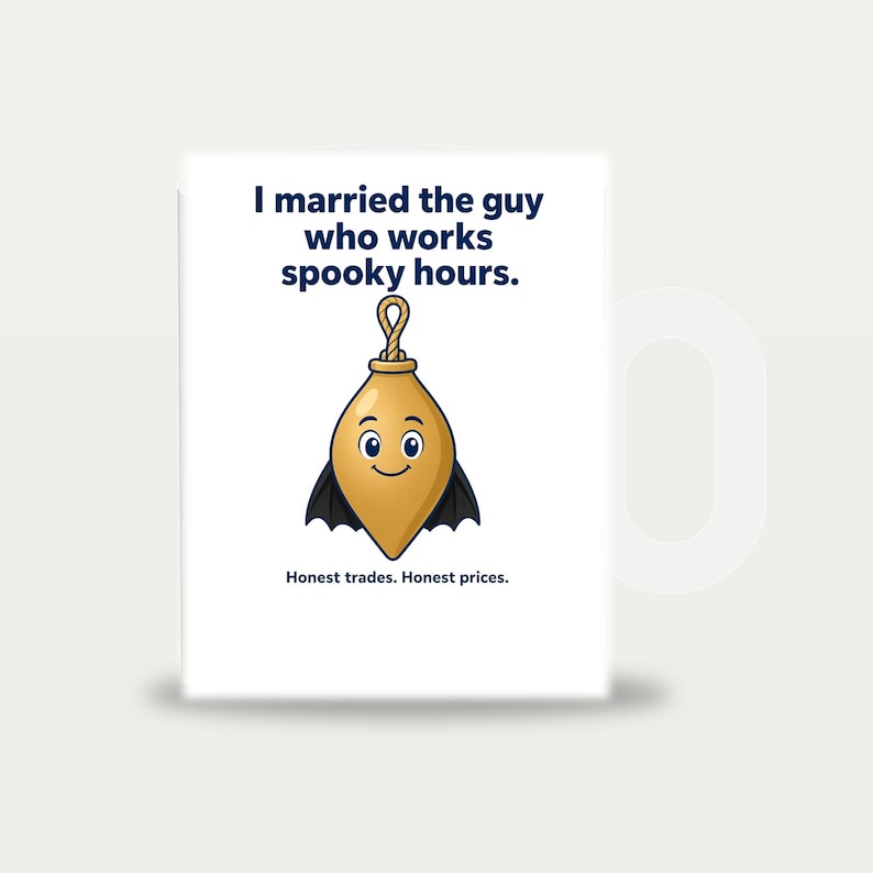 May include: A white ceramic mug featuring the text I married the guy who works spooky hours. at the top and Honest trades. Honest prices. at the bottom. In the centre is a cartoon illustration of a gold plumb bob with bat wings and a face.