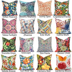 May include: A collection of sixteen square throw pillows featuring diverse patterns including floral, geometric, abstract, and animal prints. Each pillow displays unique color combinations such as blue, orange, pink, green, and black, labeled with names like Telfair Peacock, Blooms Neptune, Sunny Spot, Copeland Fiesta, Tabea Twilight, Zhanna, Este Multi, Calma Multi, Trucotte Onyx, Seascape, Zen Fiesta, Flower Child, Valeda Breeze, Sun River Sky, Clemens Noir, and Gardenia Bloom.