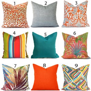 May include: Nine decorative throw pillows with various designs. Pillows include animal print, solid colors, striped, and floral patterns. Colors include orange, teal, gray, and multi-colored. The pillows are square-shaped and likely for home decor.