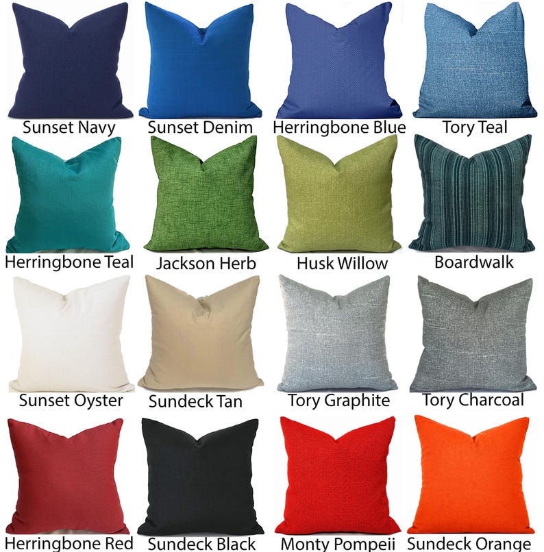 May include: A collection of sixteen square throw pillows in various colors and textures, labeled with names including Sunset Navy, Sunset Denim, Herringbone Blue, Tory Teal, Herringbone Teal, Jackson Herb, Husk Willow, Boardwalk, Sunset Oyster, Sundeck Tan, Tory Graphite, Tory Charcoal, Herringbone Red, Sundeck Black, Monty Pompeii, and Sundeck Orange.