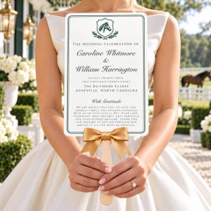 May include: A rectangular wedding program fan with a dark green horse crest, gold ribbon, and text detailing the marriage of Caroline Whitmore and William Harrington on August 26, 2028, at The Biltmore Estate in Asheville, North Carolina.