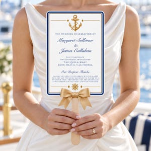 May include: A rectangular wedding program fan with a white background, navy blue border, and gold anchor graphic. It features the text: The Wedding Celebration of Margaret Sullivan & James Callahan, July Fourteenth, Two Thousand Twenty-Nine, The Queen Mary, Long Beach, California, Our Deepest Thanks, and a gold ribbon bow.