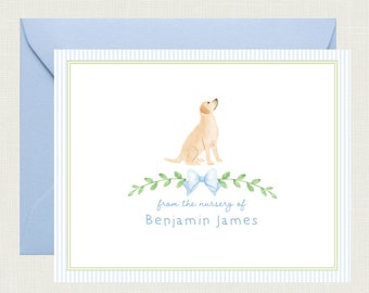 May include: A white card with blue and green stripes. A watercolor illustration of a yellow labrador retriever sitting with a blue bow. The text "from the nursery of Benjamin James" is printed on the card.