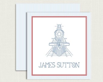May include: A blue and white striped card with a red border. The card features a line drawing of a train engine and the text "JAMES SUTTON".