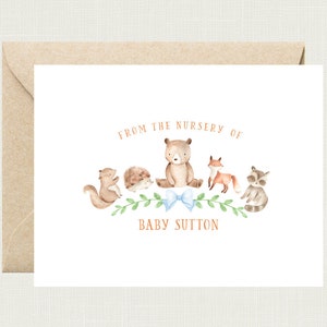 May include: A white card with a watercolor illustration of a bear, squirrel, hedgehog, fox, and raccoon. The text "From the nursery of Baby Sutton" is printed in brown.
