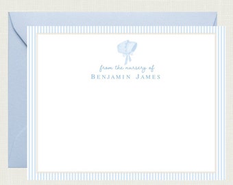 May include: Blue and white striped stationery card with a blue baby bonnet illustration and the text "from the nursery of BENJAMIN JAMES".