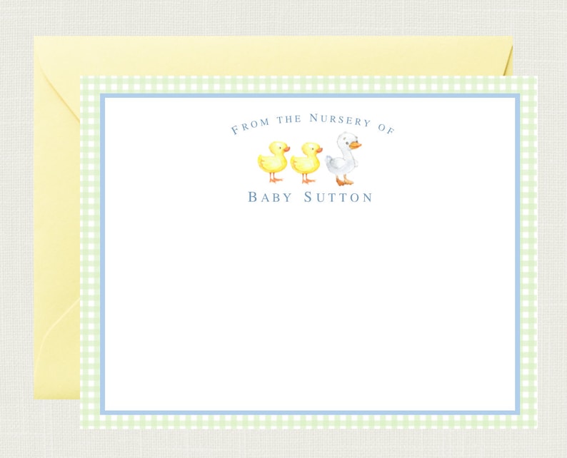 May include: A light blue and green gingham border surrounds a white card with the text "From the Nursery of Baby Sutton" and a picture of three ducklings, two yellow and one white.