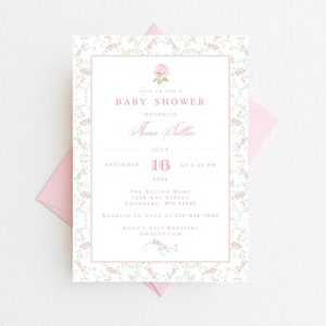 May include: A pink and white floral baby shower invitation with a delicate floral border. The invitation reads "Join us for a Baby Shower Honoring Anna Sulton, Saturday, July 16, 2024 at 1:00 PM. The Sutton Home, 1234 Any Street, Anywhere, MO 12345. Regrets to Anna at 123-456-7890. Anna's Gift Registry Amazon.com"