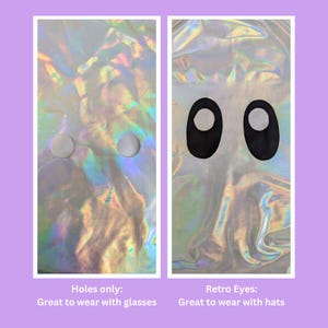 May include: Two images of a holographic fabric mask. The first image shows the mask with two small holes for the eyes. The second image shows the mask with two black oval shapes for the eyes. The text below the images reads "Holes only: Great to wear with glasses" and "Retro Eyes: Great to wear with hats".