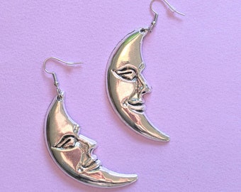 Silver Metallic Moon Earrings - Crescent Moon Dangles - Celestial Jewelry with Man on the Moon Design