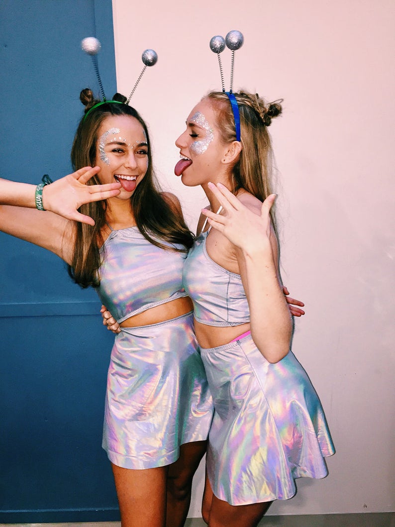 Holographic halter top and skater skirt with shiny rainbow finish.