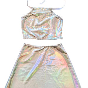Holographic halter top and skater skirt with shiny rainbow finish.