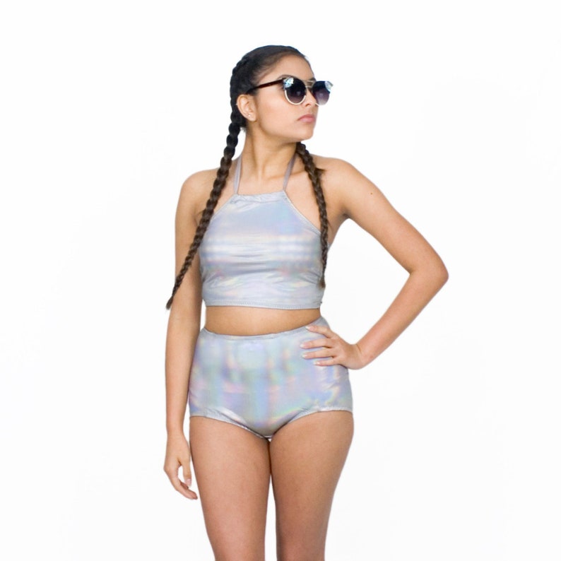 a woman wearing a holographic swimsuit