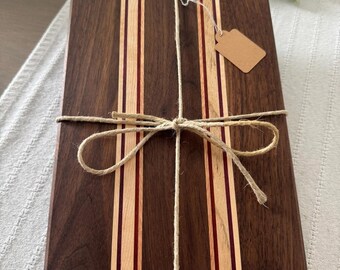Black Walnut cutting board with Purple Hear, African Padua and Okoume wood strips