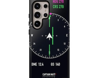 Könnte beinhalten: Eine schwarze Smartphone-Hülle mit einer Grafik eines primären Fluganzeigers. Das Design umfasst eine weiße Kompassrose, eine grüne vertikale Kurslinie sowie den Text HDG 270, CRS 270, DME 12.4, GS 140 und CAPTAIN MATT AVIATION.