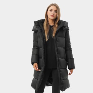 May include: A long, black, quilted puffer coat featuring a high collar, a hood, and a full-length front zip closure with a snap-button placket. The coat has long sleeves with ribbed cuffs and a smooth, matte finish throughout the exterior.
