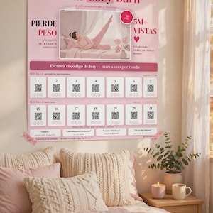 May include: A pink wall poster titled 21 días Cozy Burn featuring a central photograph of a person exercising on a bed, surrounded by text, a 5M+ Vistas badge, and a grid of twenty-one numbered QR codes with circular checkboxes for daily tracking.