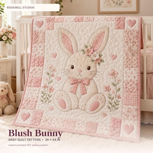 May include: A quilted baby blanket featuring a central cream-colored bunny with a pink bow, floral accents, and heart motifs. The border consists of pink and white floral and checkered patches. Text reads: Blush Bunny Baby Quilt Pattern 36 x 44 in.