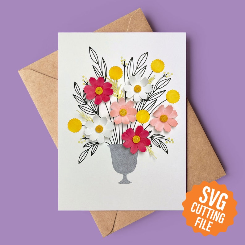 May include: A digital download SVG cutting file for a card featuring a vase with a bouquet of pink, white, and yellow paper flowers. The vase is grey and the flowers are outlined in black.