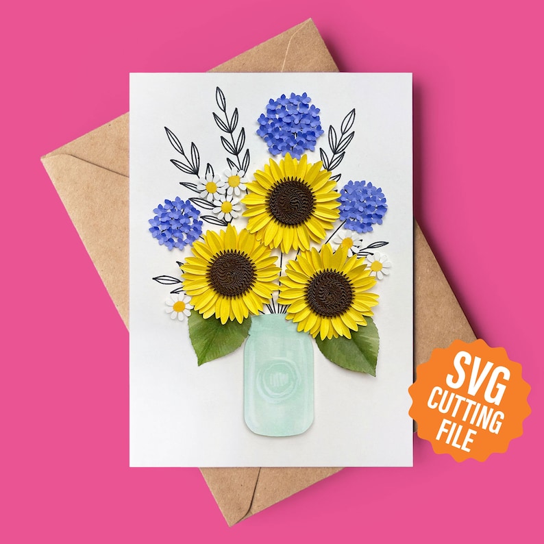 May include: A digital cutting file featuring a bouquet of sunflowers, blue hydrangeas, and white daisies in a mason jar. The flowers are arranged in a vase with a rustic, farmhouse style.