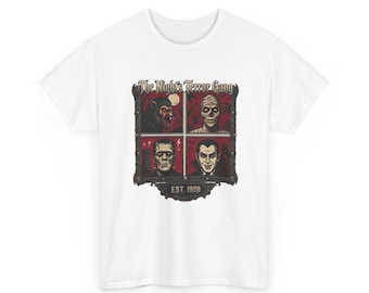 May include: A white short-sleeve t-shirt featuring a graphic print of four classic horror characters in a framed grid. The text reads The Night's Terror Gang and EST. 1920. The characters include a werewolf, a mummy, a monster, and a vampire.
