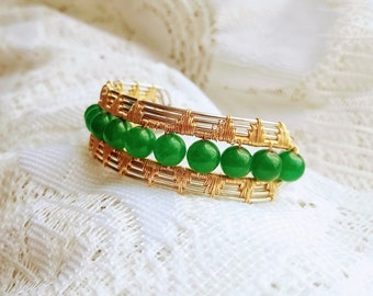 Jade beads set in beautiful silver and gold toned wire. Handmade.