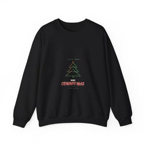 May include: A black long-sleeve sweatshirt featuring a graphic of a green outlined Christmas tree with small red dots. Above the tree is the text // git log --december and below is the text MERRY COMMIT-MAS followed by // commit -m git tags.