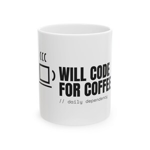 May include: A white ceramic mug featuring a black graphic of a square cup with steam lines and the bold black text "WILL CODE FOR COFFEE" followed by the smaller text "// daily dependency" printed on the front surface of the cylindrical vessel.