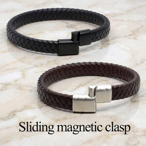 May include: Two braided leather bracelets with sliding magnetic clasps. One bracelet is black with a matte black metal clasp, and the other is dark brown with a brushed silver-tone metal clasp. The text Sliding magnetic clasp is visible.